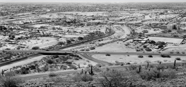 The Santa Cruz River in 2003 from the side of Sentinel Peak (A Mountain); the road in the foreground is Starr Pass Blvd. The agricultural farming is gone as well as much of the floodplain and riparian vegetation. Photo credit: U.S. Geological Survey.